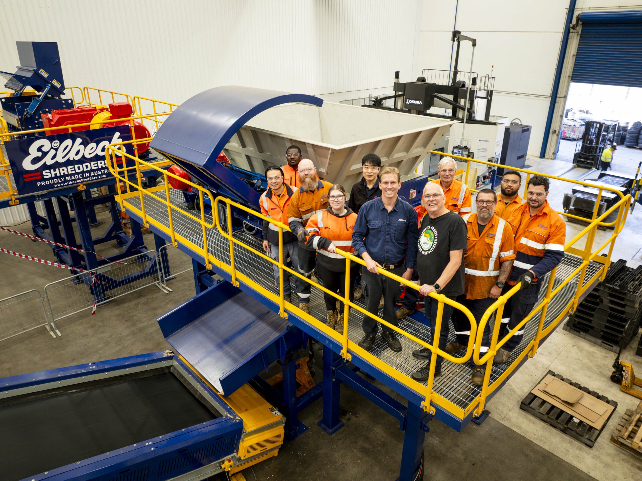 The Eilbeck team in hi-vis on the walkway of the shredding line