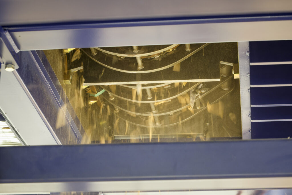 Fuel chip falls through the opening below a rasper